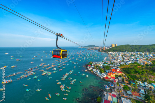 The longest cable car situated on the Phu Quoc Island in South Vietnam and below is traditional fishermen boats lined in the harbor of Duong Dong town in the popular Hon Thom island