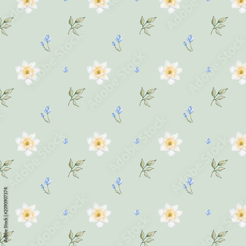 Bright patterned fabric with flowers and leaves arranged in a regular design on a light green background