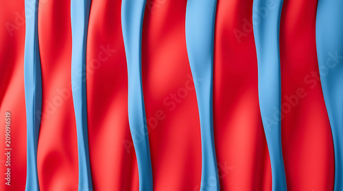 Red fabric draped with blue ribbons in studio lighting for a modern abstract backdrop