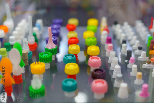 Assorted Colorful Plastic Spout Caps on Display