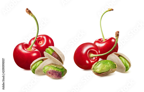 Sweet cherries and green pistachio nuts isolated on white background. Real photography