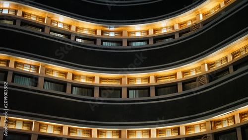 Photography Modern hotel building curved balcony floors golden light architecture night