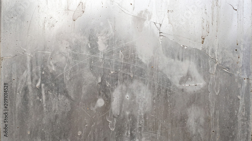 Grunge dirty glass texture background, weathered scratched pane with smudges stains, finger prints and grime, high resolution copy space horizontal