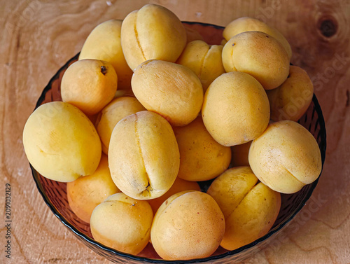 Fresh apricots, probably of the Shalah variety, known for their aroma and juiciness.