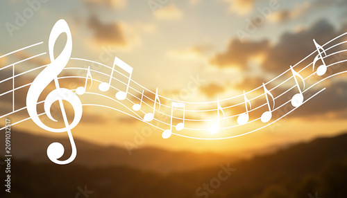 Abstract music notation overlay on sunset mountain landscape