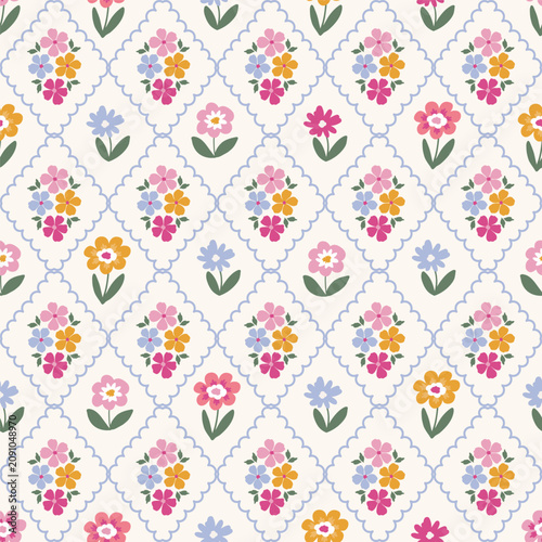 Seamless pattern with hand drawn floral bouquets inside blue wavy diamond lattice and scattered flowers on cream background.