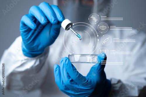 Scientist in protective suit using dropper and petri dish with futuristic medical interface, representing biotechnology research, healthcare, vaccine, laboratory analysis and healthcare technology.