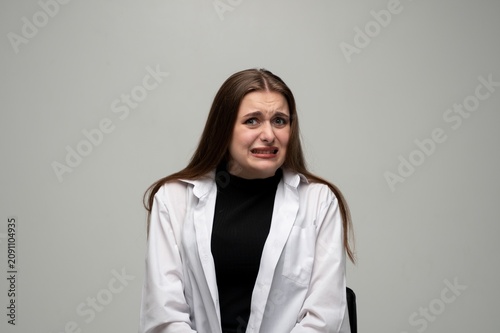 Vászonkép Woman expressing disgust, feeling revulsion or aversion, grimacing with negative