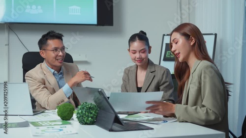 Business team discussing corporate social responsibility and ESG strategy in a modern office meeting