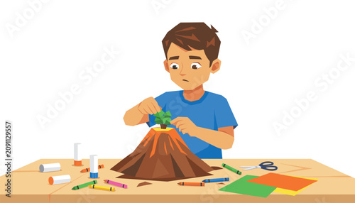 Young boy carefully constructs a miniature volcano model for a school science project while sitting at his desk surrounded by art supplies.