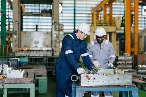 Engineer worker team service injection mold, Professional men work in die casting plant mold service