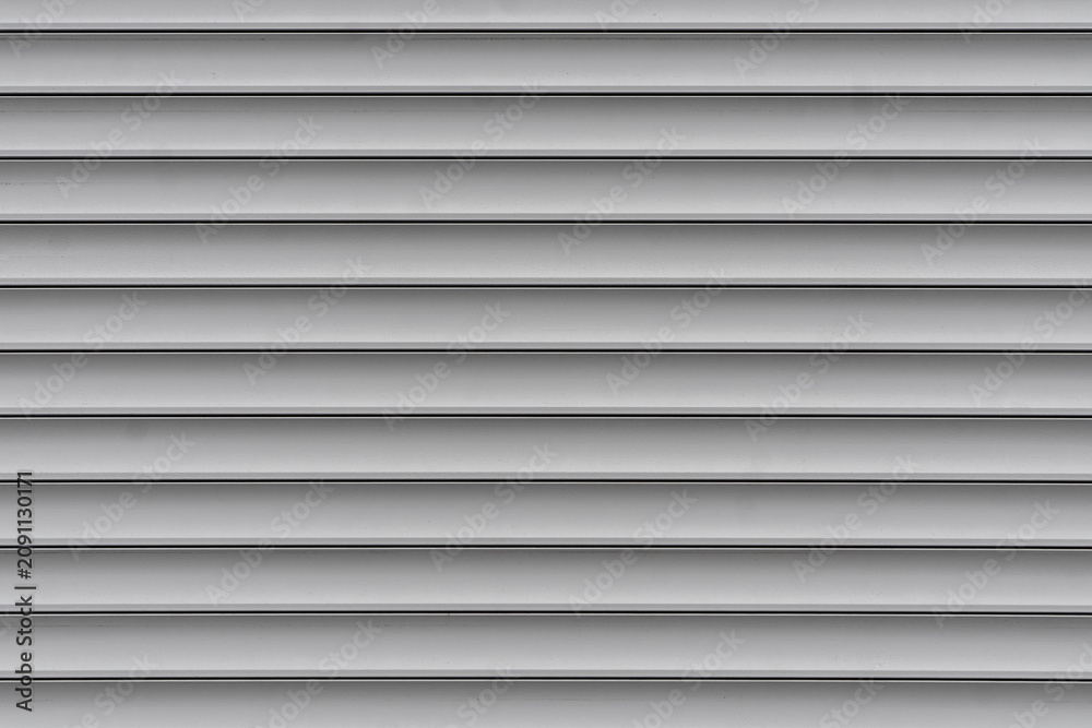Fototapeta premium Grey horizontal metal roller shutter or siding texture back
