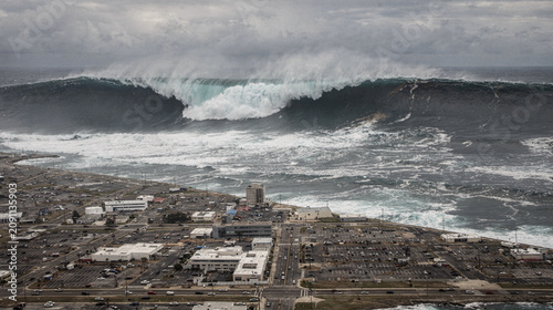 Tsunami Wave Approaching Coastal City Aerial View