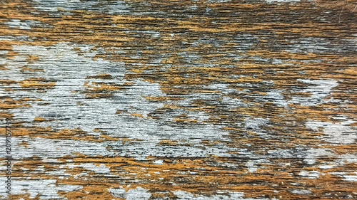 Tableau sur toile Abstract texture of old weathered wood surface with peeling paint and rust color