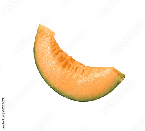 Фотография Flying fresh raw ripe cantaloupe melon isolated on a white background