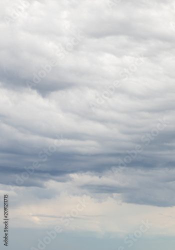 Sky replacement floating dark clouds after storm