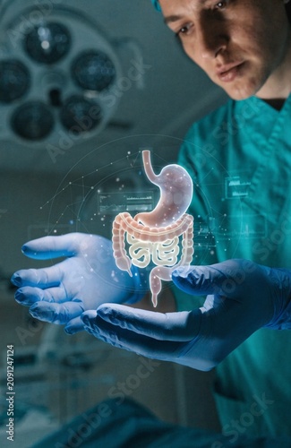 Doctor Holding Digital Digestive System Hologram for Gastroenterology and Medical Innovation