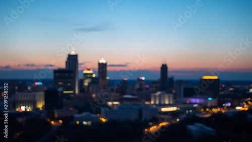 Austin evening skyline, city lights, vibrant urban atmosphere, soft ambient light.