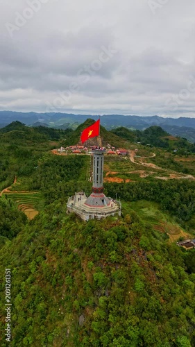 Vietnamese flag waving on the Lung Cu Flag Tower in Ha Giang