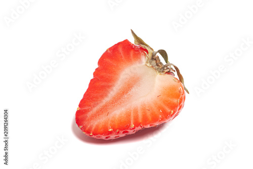 Juicy strawberry cut in half isolated on white
