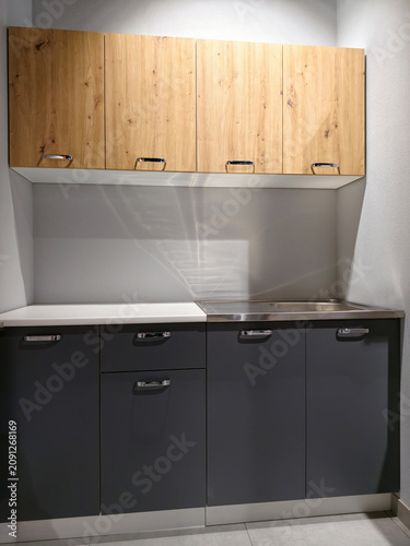Modern kitchen setups displayed to inspire home renovations in a large retail space
