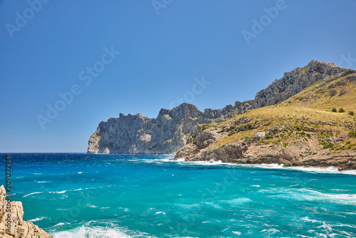 Bild auf Leinwand Cala figuera turquoise sea washing rugged cliffs mallorca