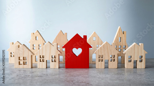 Red house icon with heart in residential neighborhood