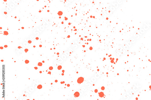 Red paint splatters on white background, abstract messy texture