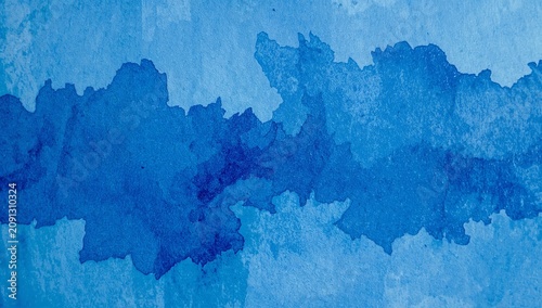 Watercolor Design With Different Shades of Blue Creates a Soft Background for...