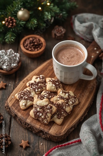 Warm Drink and Cookies on a Wooden Board During Winter Holiday Season