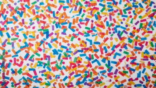 Colorful Confetti Scattered on a White Surface for a Celebration or Party Event