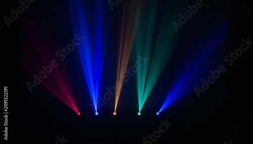 Colorful Beams of Light Shine in a Dark Space During a Music Event