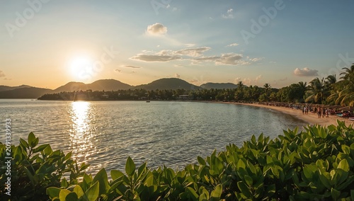 Sunset Over the Beach With Mountains and Palm Trees in the Background Near a ...