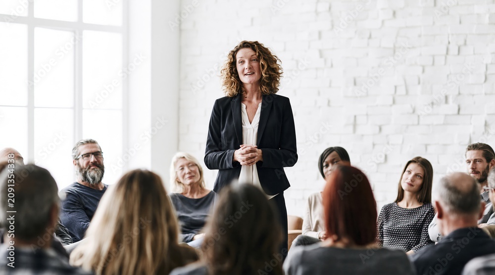 Fototapeta premium Businesswoman leading a meeting with diverse team in modern office