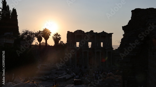 Night view of the historic Ephesus Ancient City in Turkey, showcasing illuminated Roman ruins and timeless classical architecture after sunset.