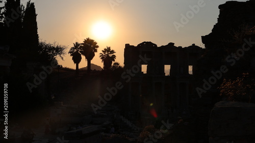 Night view of the historic Ephesus Ancient City in Turkey, showcasing illuminated Roman ruins and timeless classical architecture after sunset.