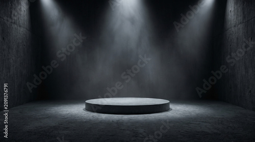 An empty concrete pedestal illuminated by dramatic spotlights in a dark industrial studio space.