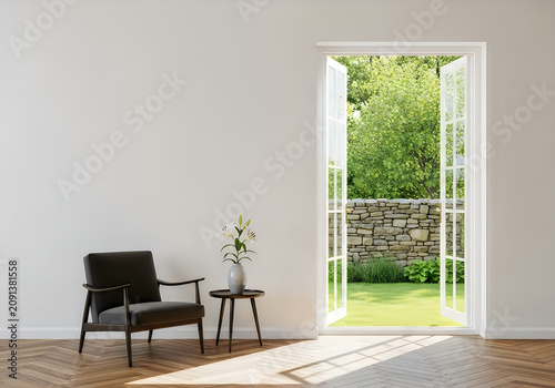 Modern armchair and table by an open door to a garden