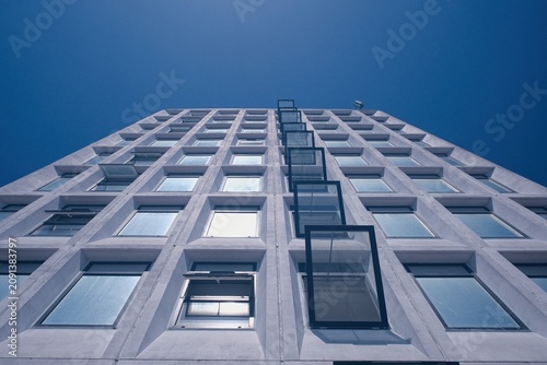 Big White office building with windows open for ventilation 