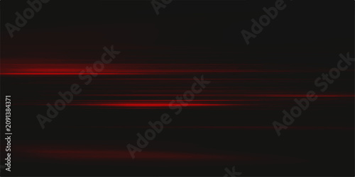 Obraz na plátně Abstract red light streaks on a dark, blurred background, evoking a sense of speed and motion