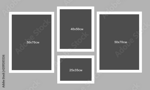 A vector set of white picture frames on a gray wall. A modern concept featuring empty picture frames. A mockup of picture frames.