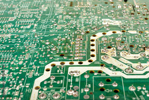 Close-up of electronic pathways and soldering points. Detailed information on printed circuit board technology.
