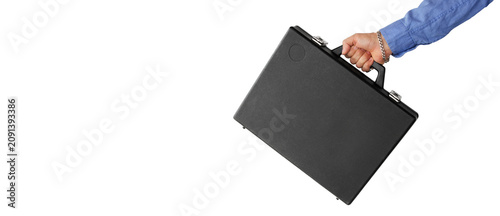 A man's hand carries a briefcase, cut out, with space for text.