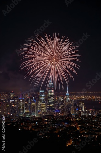 Fireworks Display Over City Skyline During Night Celebration