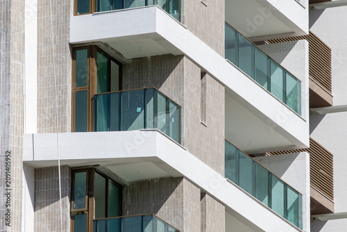 Glass-Enclosed Balconies of a Modern Residential Building