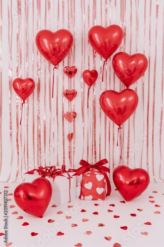 Colorful Heart Balloons and Gift Boxes at a Celebration for Love in a Decorat...