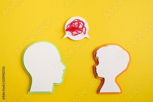 A depiction of a conversation between parents and a child, depicting their emotions