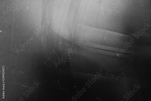 Soft ambient diagonal light gradient with retro dust and scratch overlay on a dark backdrop