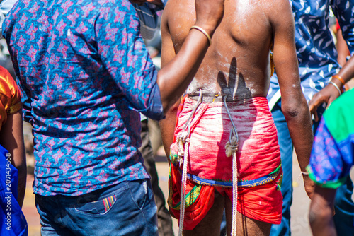 фотографія Religious ritual in Jamnagar with hooks pierced into a devotee's back