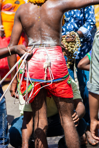 Canvastavla Man with hooks in his back during Thaipusam festival